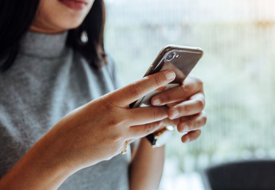Lady ordering food online via mobile phone